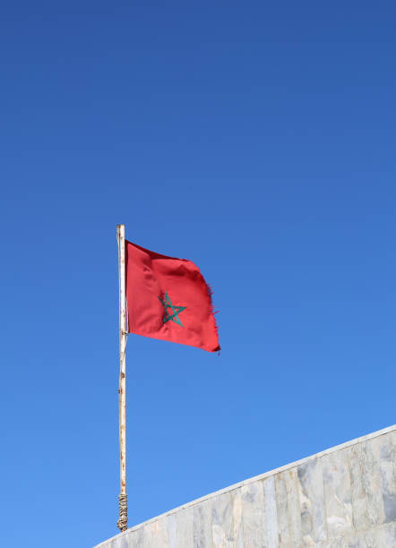 National Flag of Morocco flying in the air by the beach in Agadir, Morocco