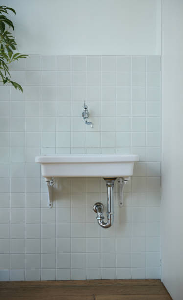istock A white wash basin surrounded by white tiles in a bathroom 2010092342
