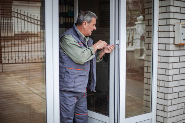 istock A worker installs an aluminum door 2010111162