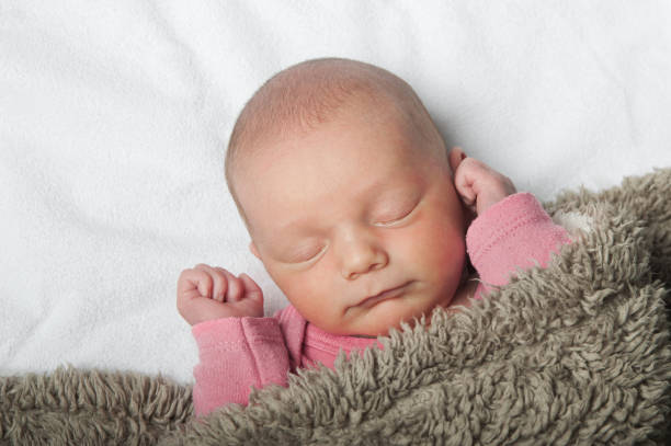 Newborn sleeping close up. Baby care concept.