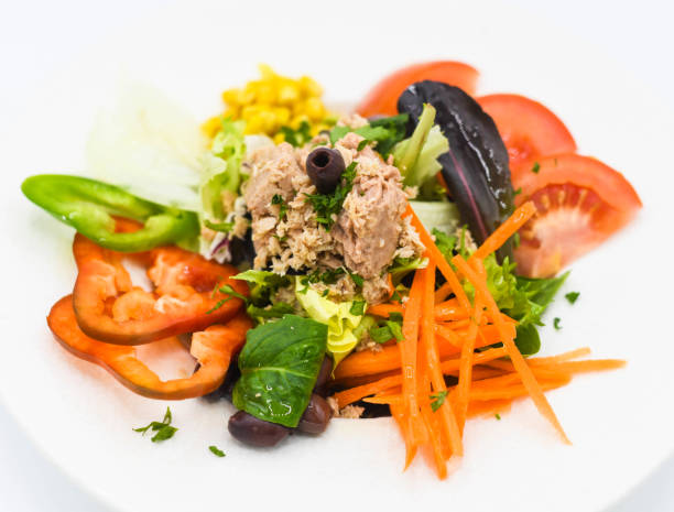 istock Tuna, tomato, carrot and black olives salad 2010139363