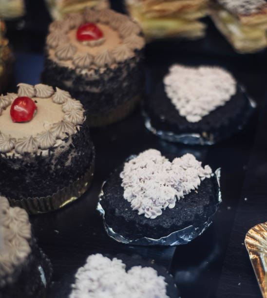 Different cakes and cupcakes in a pastry shop