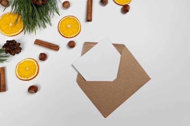 istock Christmas composition, dried orange slices, fir tree branches, cinnamon sticks, pine cones, hazelnuts on white background. 2010150681