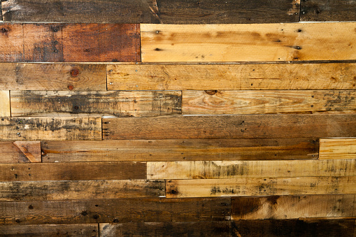 Rustic Wood Textured Background: Aged Wooden Planks with Varied Hues and Natural Patterns. Ideal for Sustainable Design, Carpentry, and Authentic Marketing Materials. Auburn, Indiana.