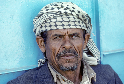 Sanaa, Yemen - June 30, 1991: portrait of old arabic man in Yemen wearing the typical head scarf.