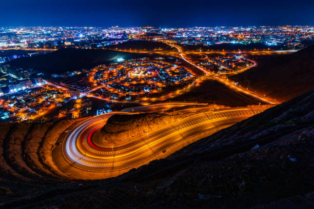 istock View from the top on wavy road in Muscat at night 2010167823