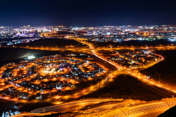 istock View from the top on wavy road in Muscat at night 2010168334
