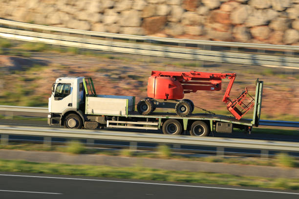 istock Truck transporting construction machinery, forklifts and lifting platforms with a ramp 2010182816