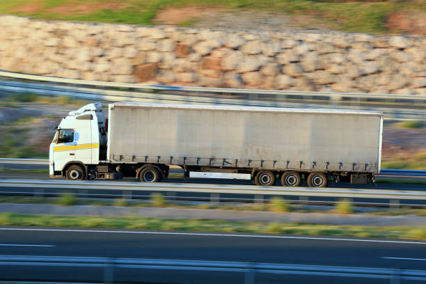 Articulated road freight truck traveling on a highway in Spain