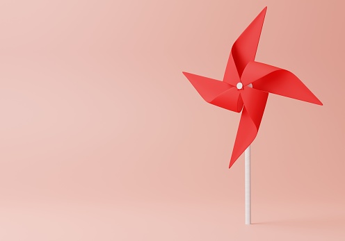 3D Colorful Red windmill on Pink Background with copy space. Minimal 3D rendering.