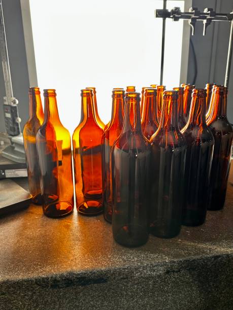 istock Quality control of glass bottles in the light. 2010195298