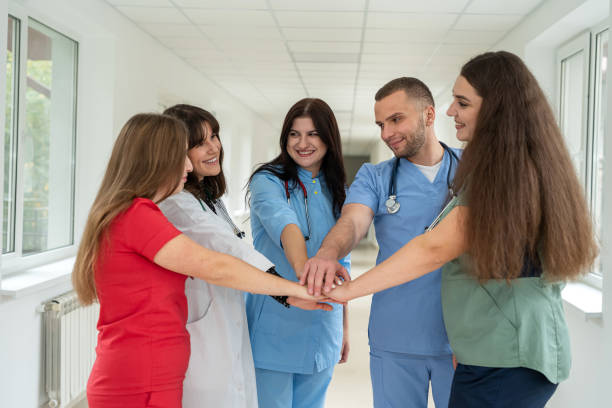istock High five, doctors in a medical team stacking hands,  collaboration and support in a hospital 2010217059
