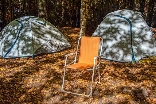 Camping tents and orange camping chairs in Yedigöller
