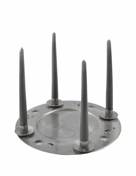 Tin plate as a candleholders on a white background