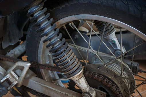 rusty motorbike gears and shocks