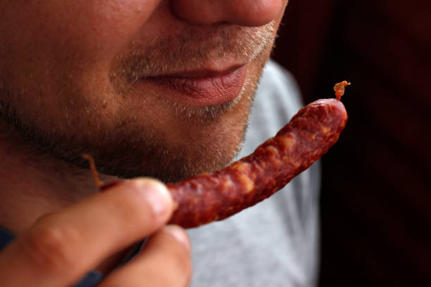 Fresh raw sausage isolated on white. Ingredient for hot dog