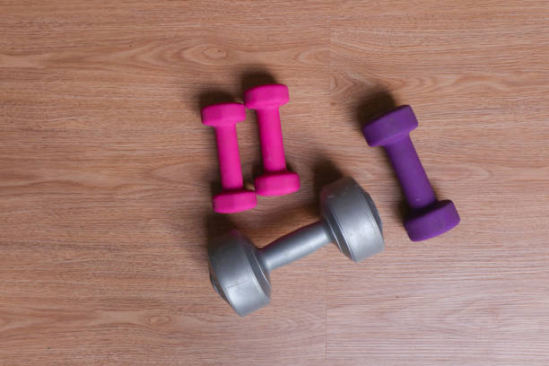 Barbell with sunlight at home gym.