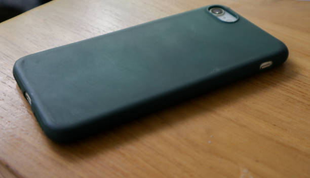 istock a smartphone over a wooden background 2010294219
