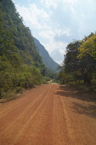 istock Mountain landscape in a valley where the road is red dirt. 2010302415