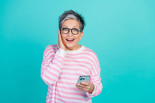 istock Photo of impressed funky woman dressed pink pullover getting sms modern gadget empty space isolated teal color background 2010304578