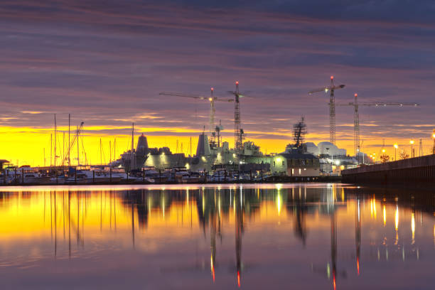 Norfolk, Virginia, USA shipyard on the Chesapeake at golden hour.