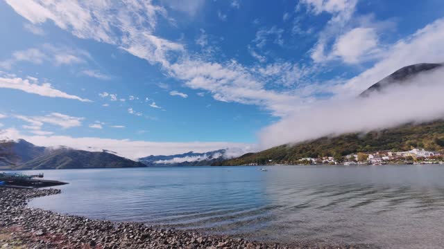 Lake Chuzenji (Chuzenjiko) at Nikko,  Japan.  Time-lapse of lake view with moving cloud with blue sky.