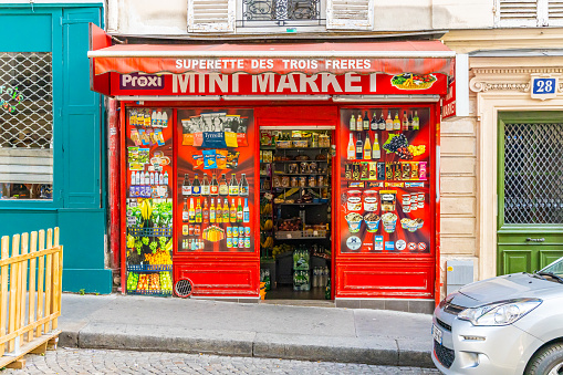 Paris, France - September 10, 2023 : Facade of a mini market shop in Montmartre district in Paris, France