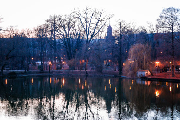 Reflections at twilight in Carol Park, a public park in Bucharest, Romania.