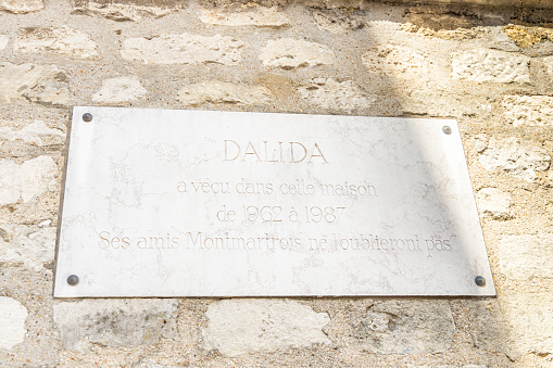 Paris, France - September 09, 2023 : Memorial plate on the wall of the house of singer Dalida in the Montmartre district in Paris, France