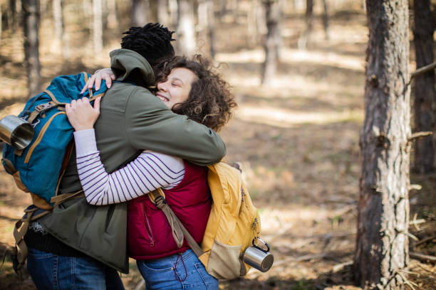 istock Young beautiful couple are hugging in the forest. 2010366220