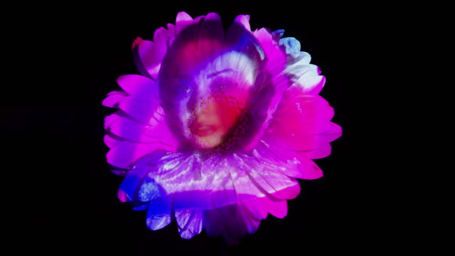 Woman's face projection on a flower