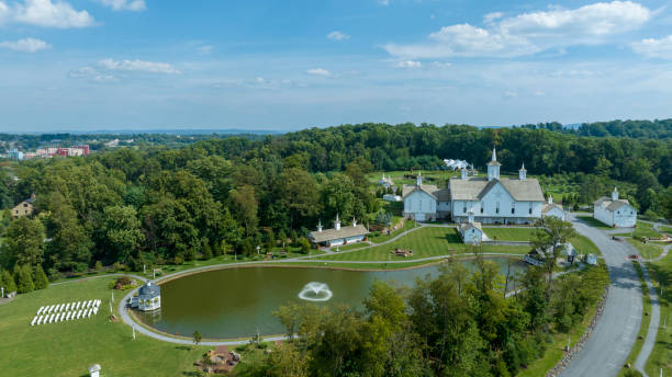 istock Aerial View Religious Complex With Multiple White Buildings Shining Golden Domes, Pond With Fountain 2010401542