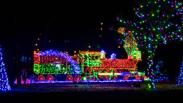 istock Night View Of An Elaborate Christmas Light Display Featuring A Multicolored Lit Train 2010406845