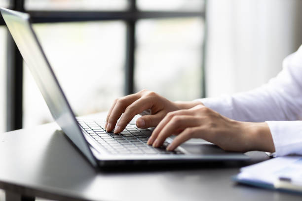 istock Woman typing on laptop keyboard. 2010413290