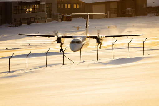 Airplane is preparing for takeoff in winter.