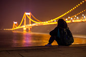 Boy playing under the Yangtze River Bridge