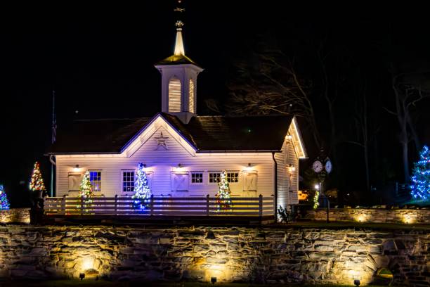 istock Quaint White Chapel Adorned With Twinkling Christmas Lights And Festive Decorations 2010452528