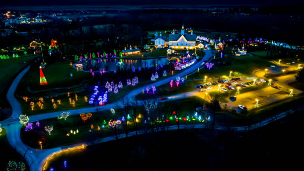 istock Expansive Aerial View Of A Festive Grounds Illuminated With Holiday Lights Featuring A Path To Pond 2010453165