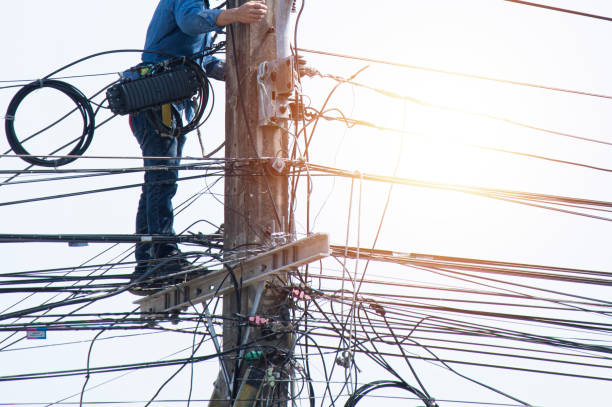istock High voltage tower work for installing wires and equipment 2010512292