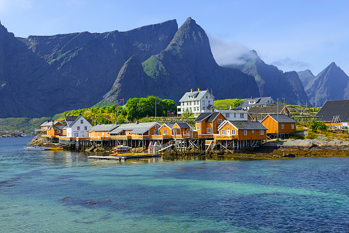 Sakrisoy, Reine fishing village in Lofoten Island, Norway - a picturesque village on the shore of a fjord surrounded by mountains