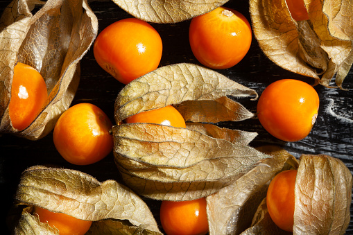 physalis group on wood background top view