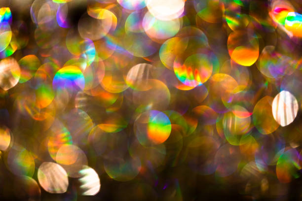 Abstract blurred multi glittering color light at night. Sparkling bokeh defocused background for good holiday concept, design, Christmas and holiday template, banner.