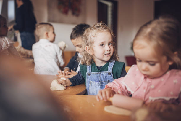 istock Children making cookies 2010543834