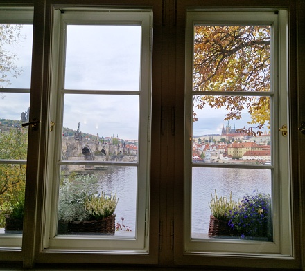Prague castle seen through old window
