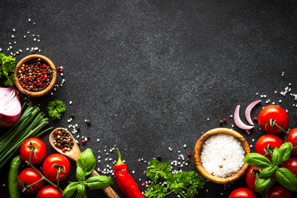 istock Food cooking background on black stone table. 2010550174