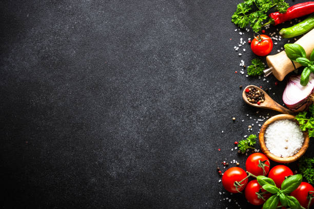 istock Food cooking background on black stone table. 2010550184