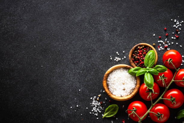 istock Food cooking background on black stone table. 2010552834