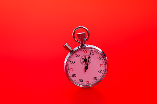 A stopwatch on red background