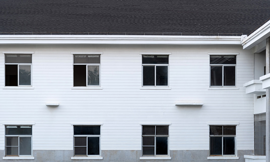 The house with white wall and black roof