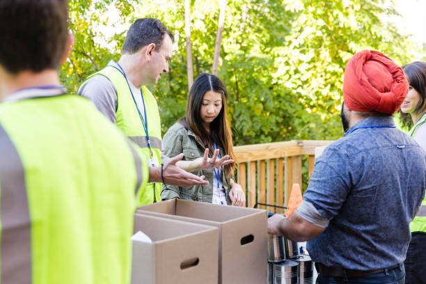 istock Husband talks to wife while volunteering at food drive 2010606840
